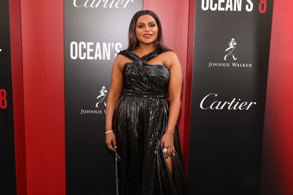 Mindy Kaling walks the red carpet of the Ocean's 8 film premiere.