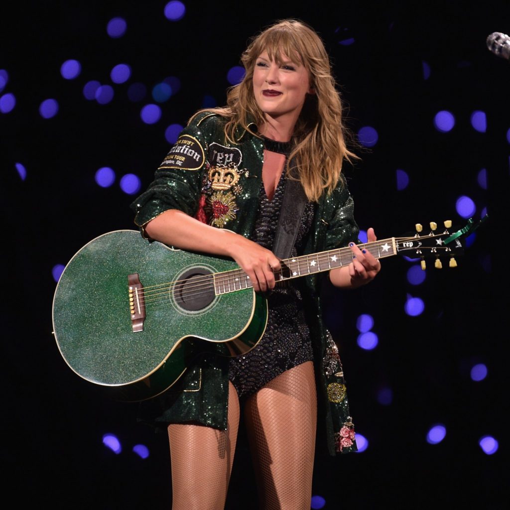 Taylor Swift wears emerald green, embellished custom jacket during Reputation Tour